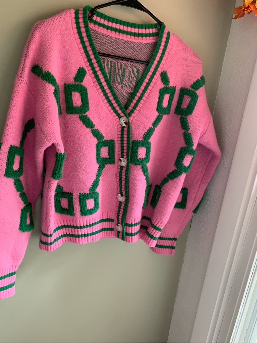 Pink V-Neck Button-Front Cardigan with Green Geometric Accents